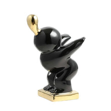 Load image into Gallery viewer, Luxury Black & Gold Adventure Boy Ceramic Sculpture – Modern Tabletop Décor Accent